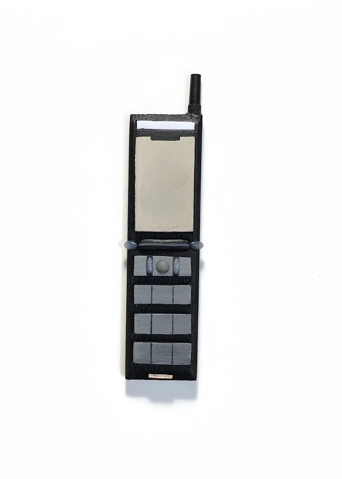 Image of Phones by Adriana Shportan, size: The average size of one phone 10 cm × 5 cm × 1.5 cm, made of wooden blocks, acrylic paint, and found/recycled materials;, Installation medium, from London, part of the “When It Is Our Turn to Be Adults” series Photo 3 of 17.