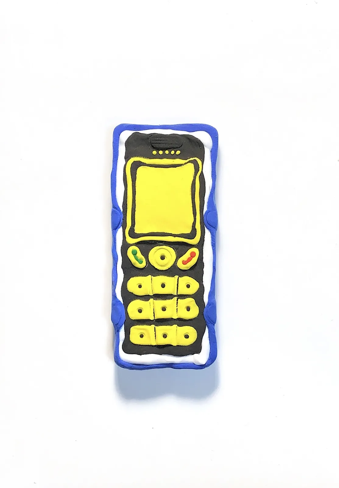 Image of Phones by Adriana Shportan, size: The average size of one phone 10 cm × 5 cm × 1.5 cm, made of wooden blocks, acrylic paint, and found/recycled materials;, Installation medium, from London, part of the “When It Is Our Turn to Be Adults” series Photo 7 of 17.